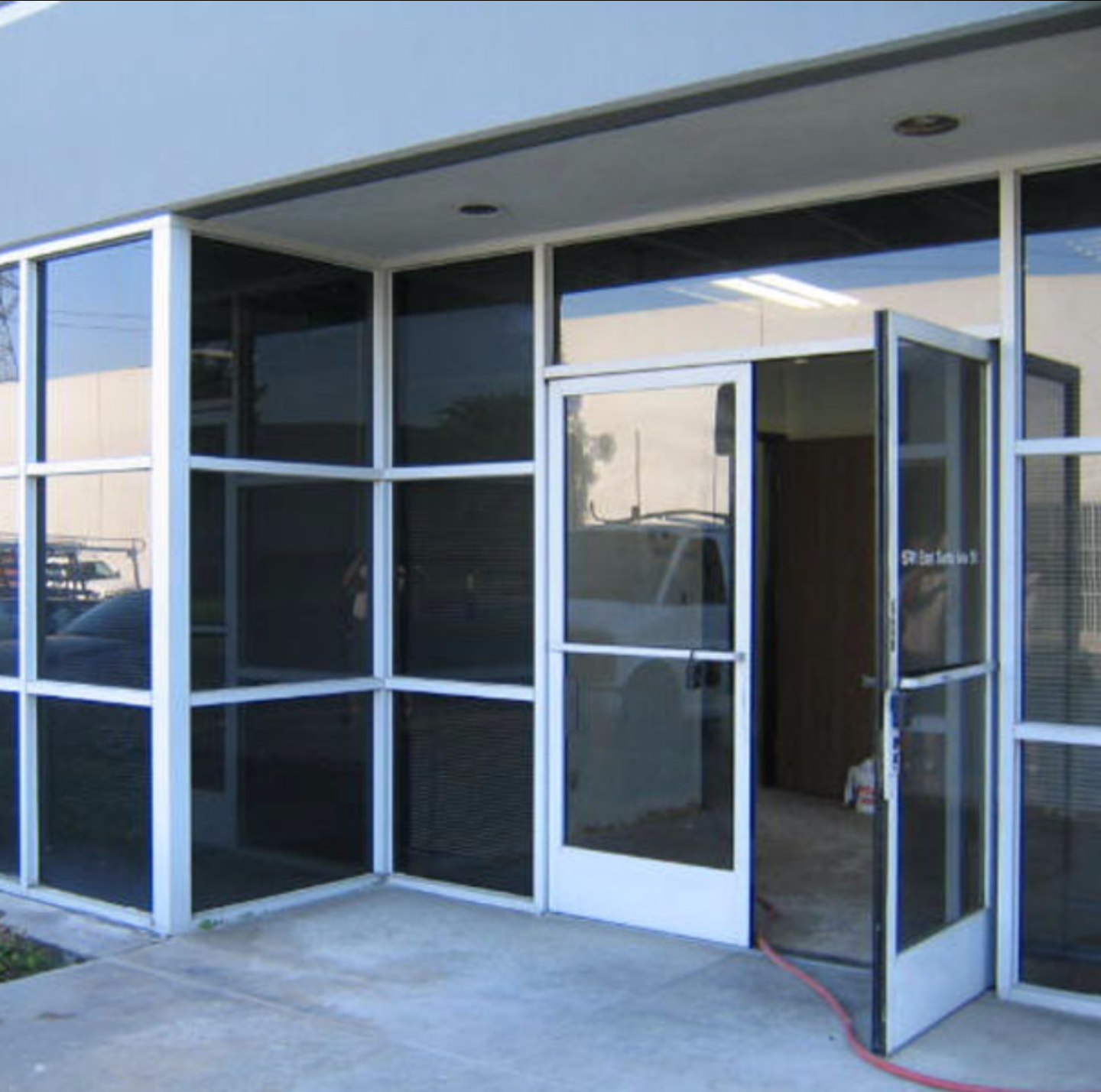 a building with a lot of windows and a door that is open.