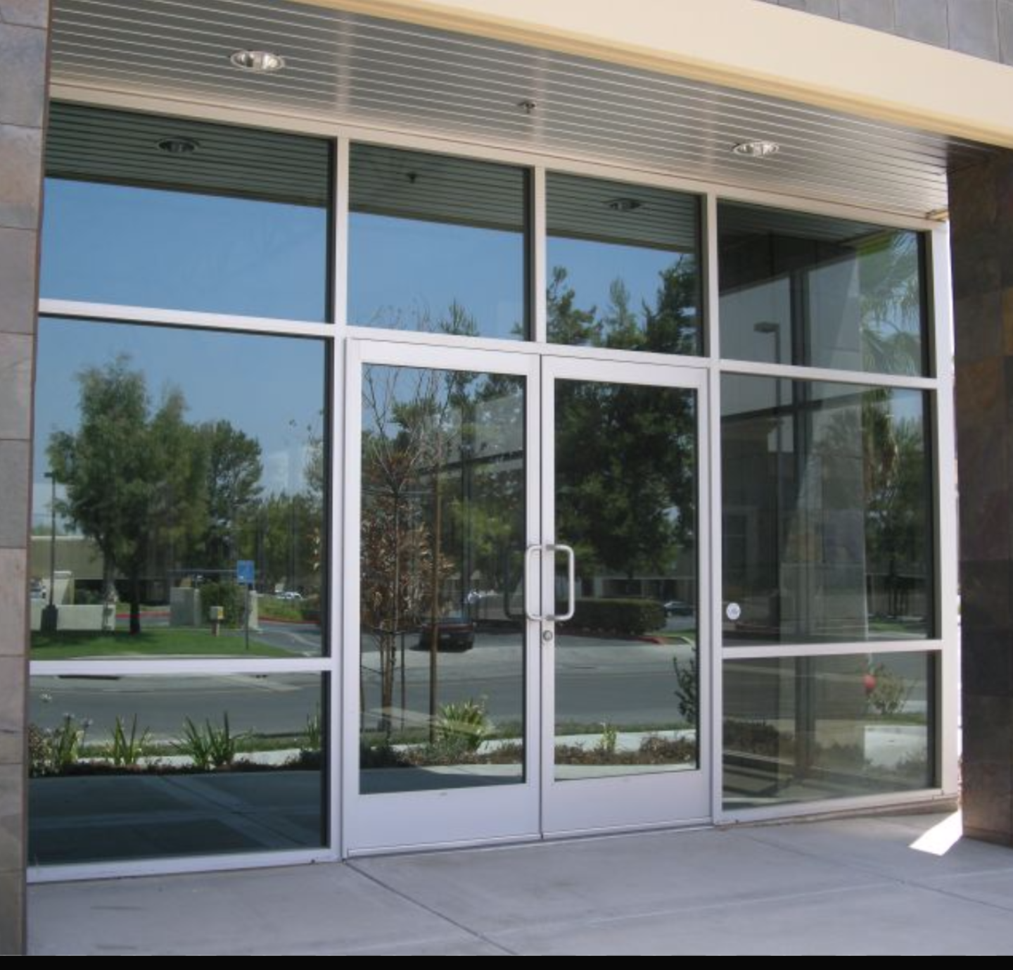 a building with a lot of windows and doors.