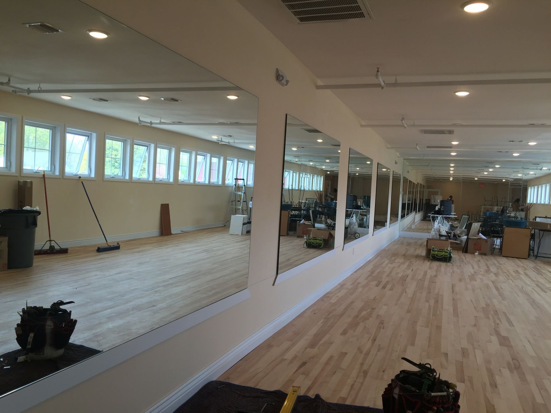 a large room with a lot of mirrors on the wall.