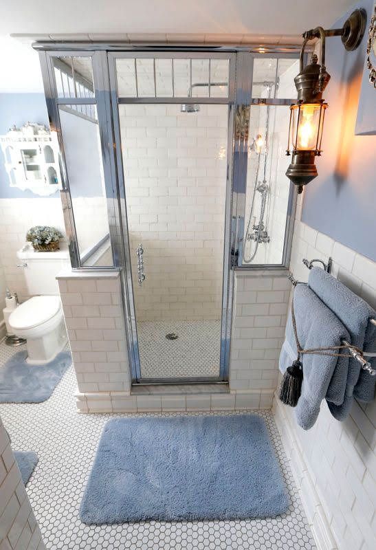 a bathroom with a walk in shower and a toilet.