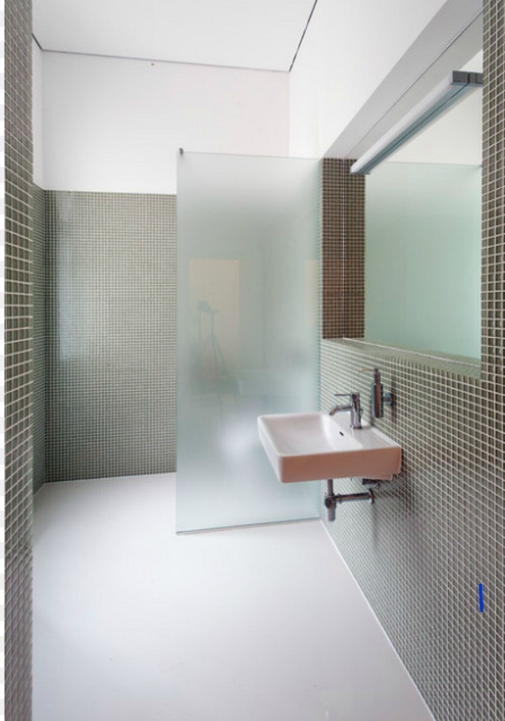 a bathroom with a sink and a mirror.