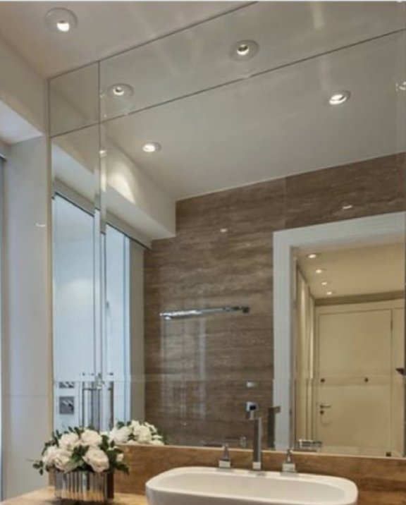 a bathroom with a sink and a large mirror.