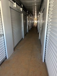 A long hallway filled with rows of storage units.