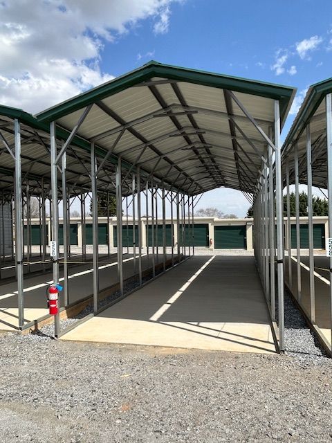A covered parking lot with a green roof