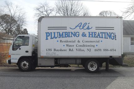 White Al's Plumbing & Heating truck parked on a residential street in Villas, NJ.