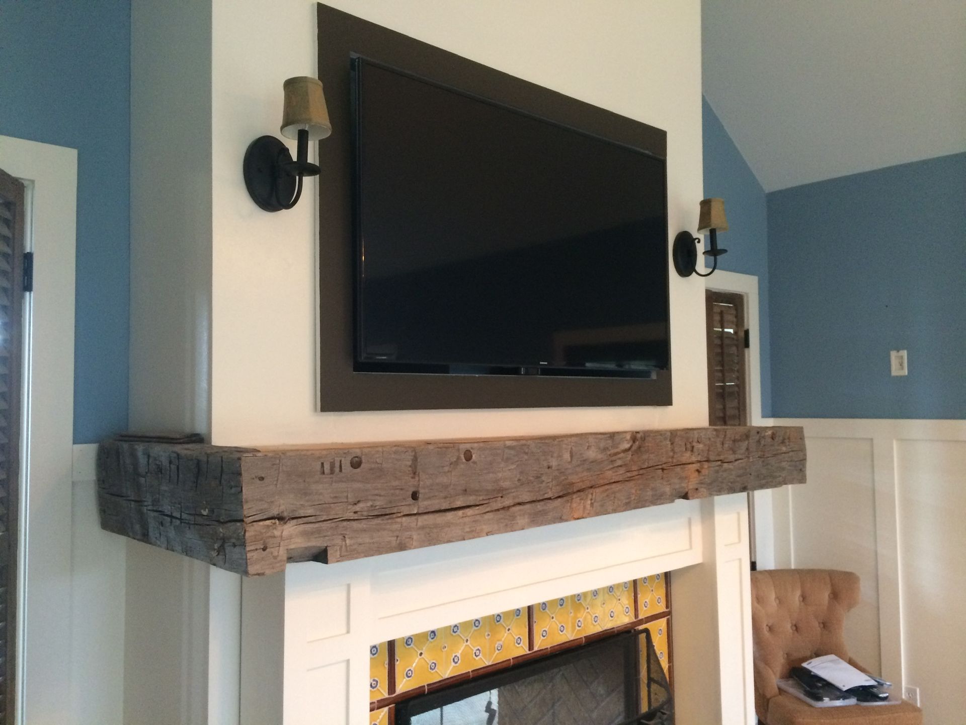 flat tv setup above a fireplace
