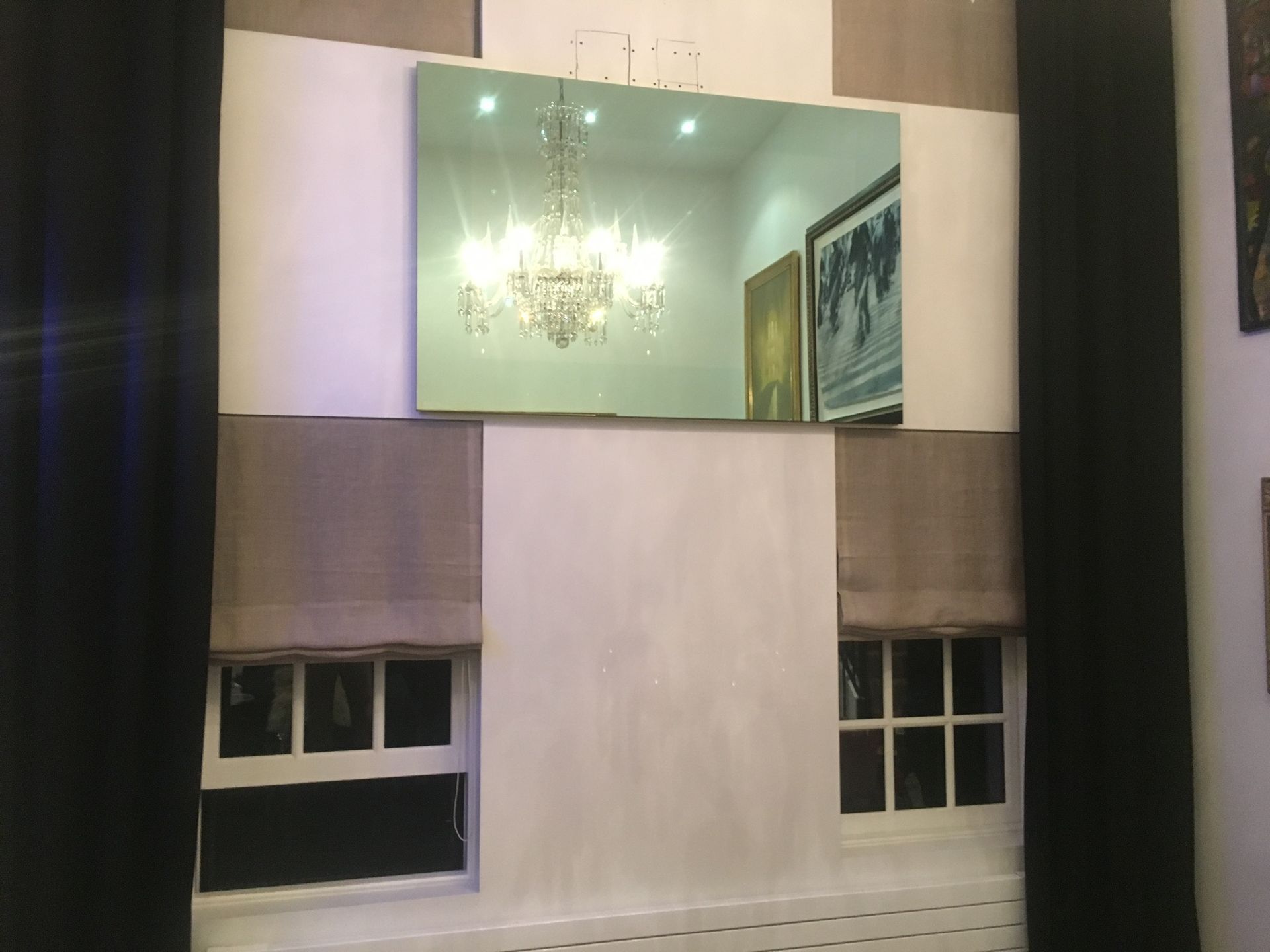 mirror mounted above the windows