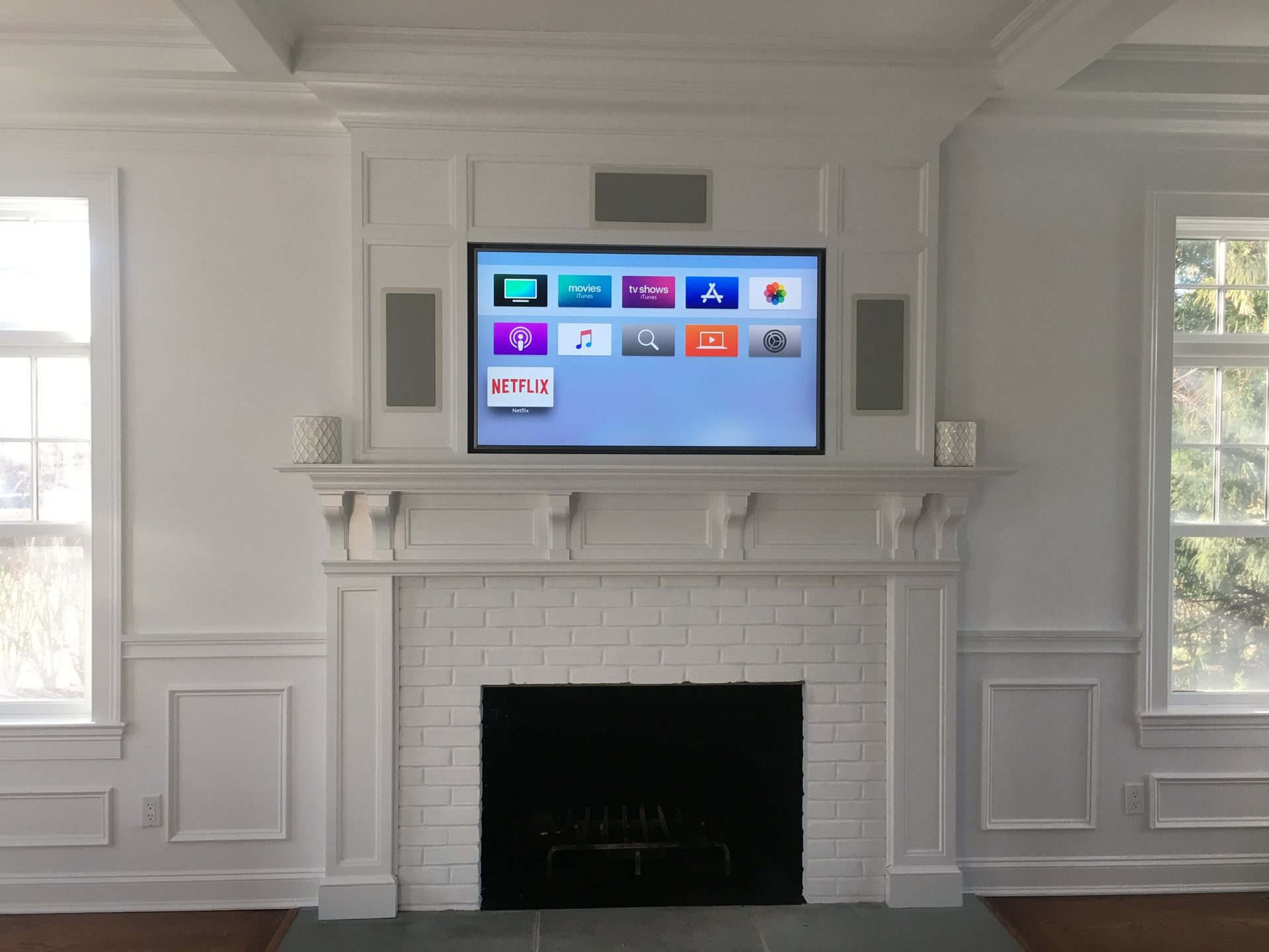 smart tv mounted on a white wall