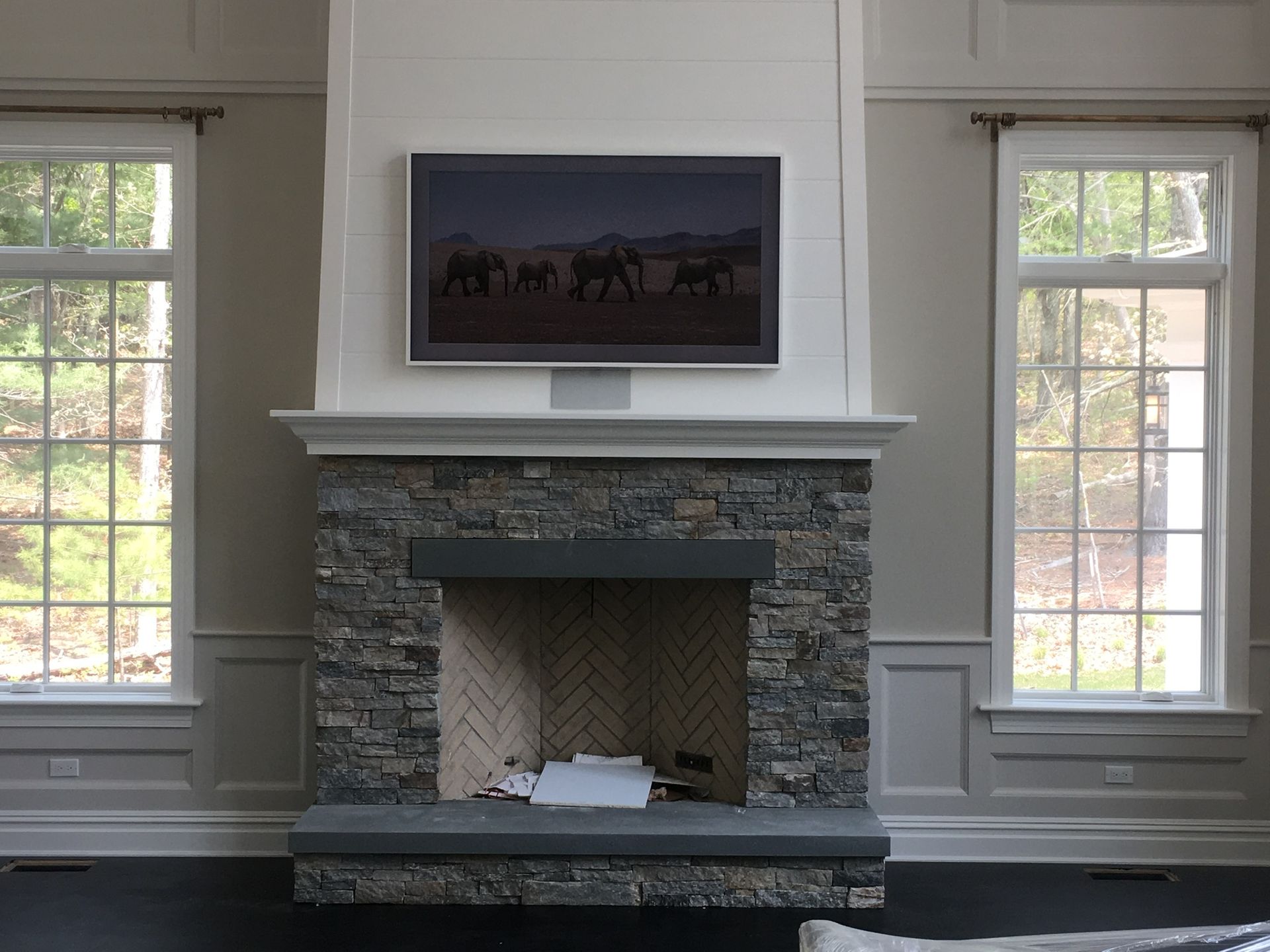 white framed tv on the wall