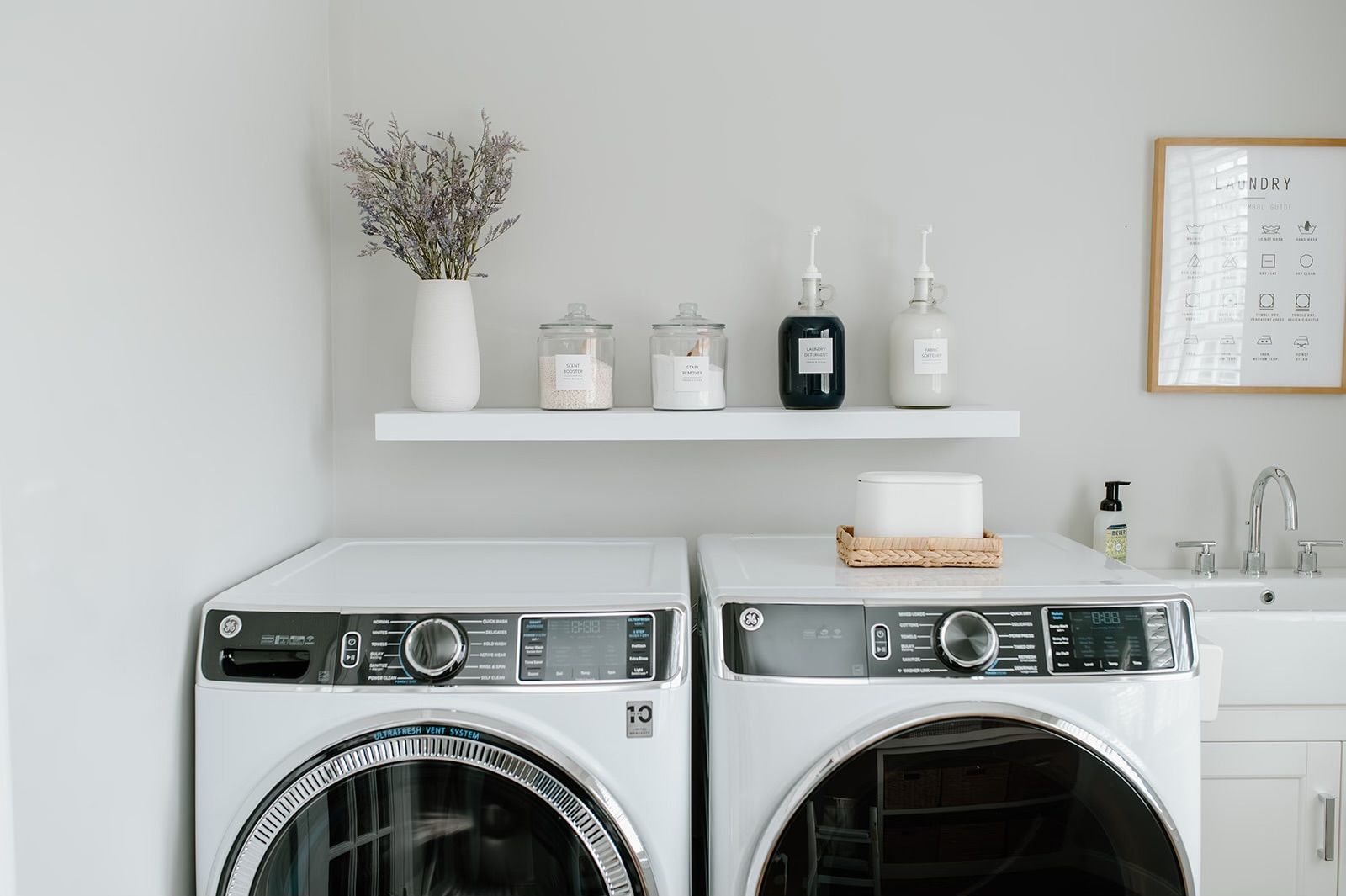 A laundry room with a washer and dryer
