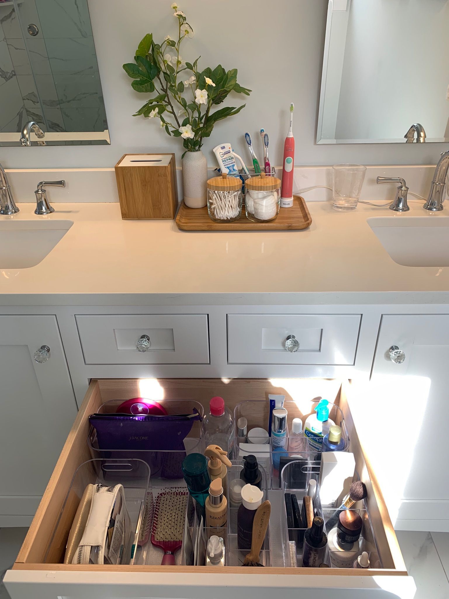 Organized drawer filled with cosmetics.