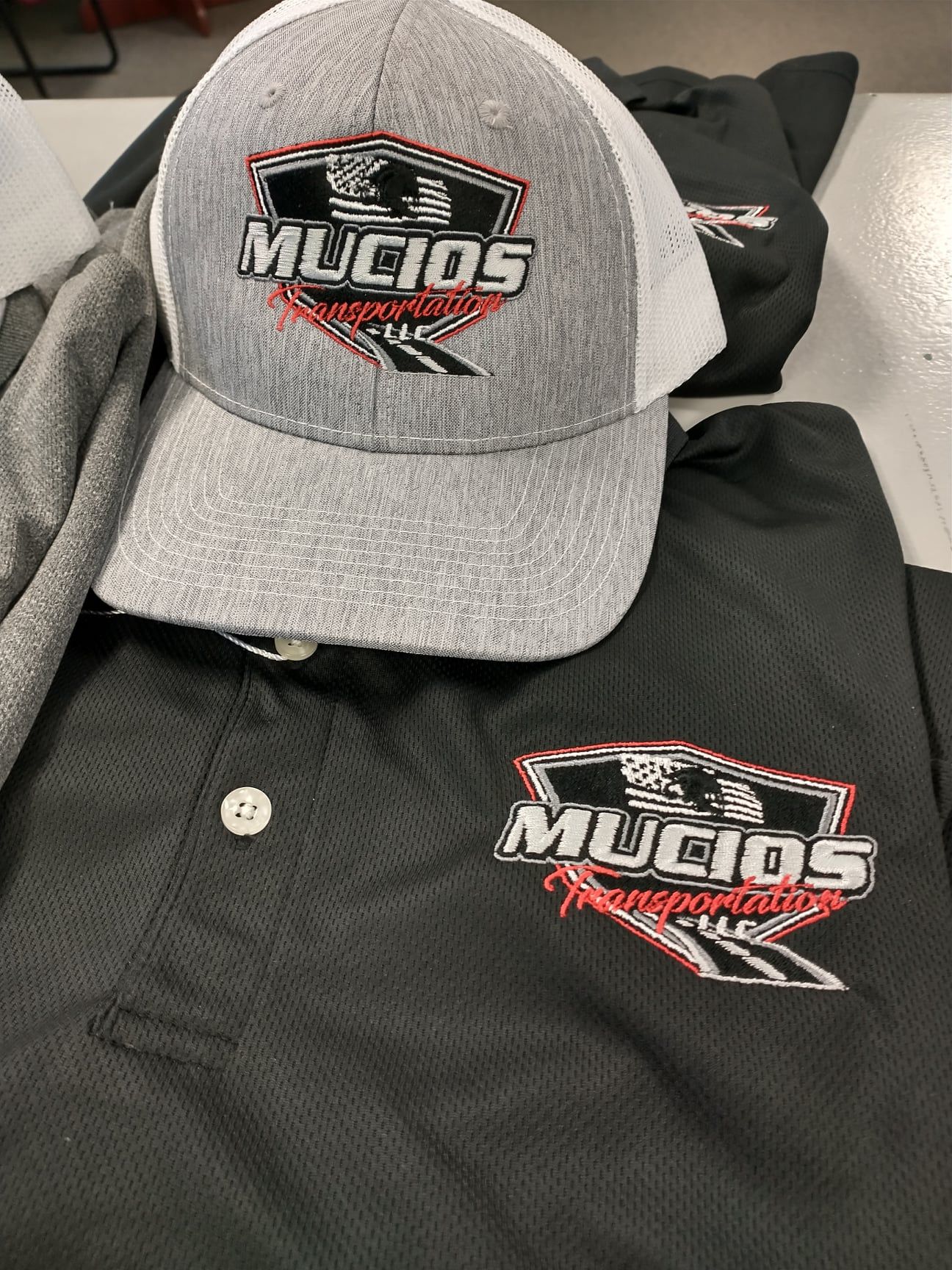 Embroidered logo on cap and shirt