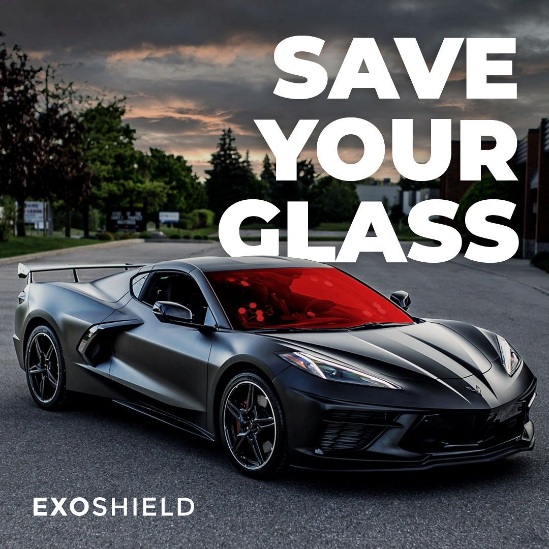 Black sports car on a road with “SAVE YOUR GLASS” and “EXOSHIELD” text overlay