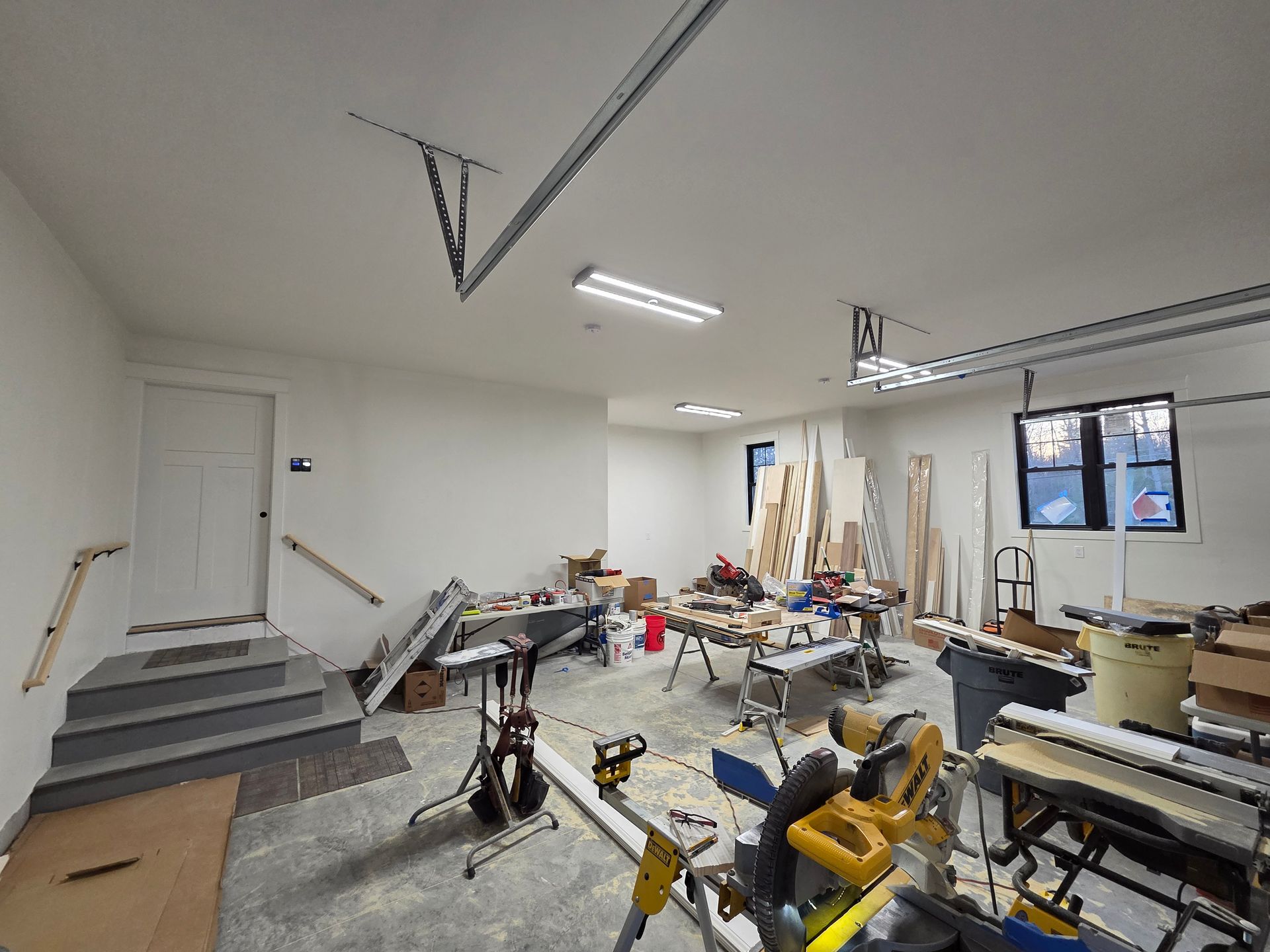 A large room with a lot of tools and boxes in it.