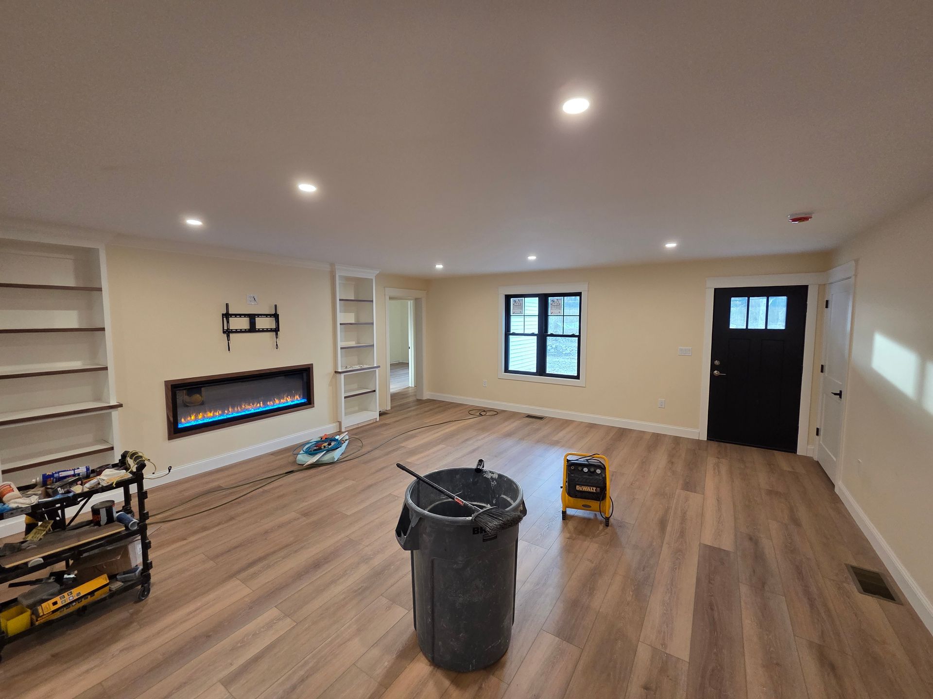 There is a trash can in the middle of the room.