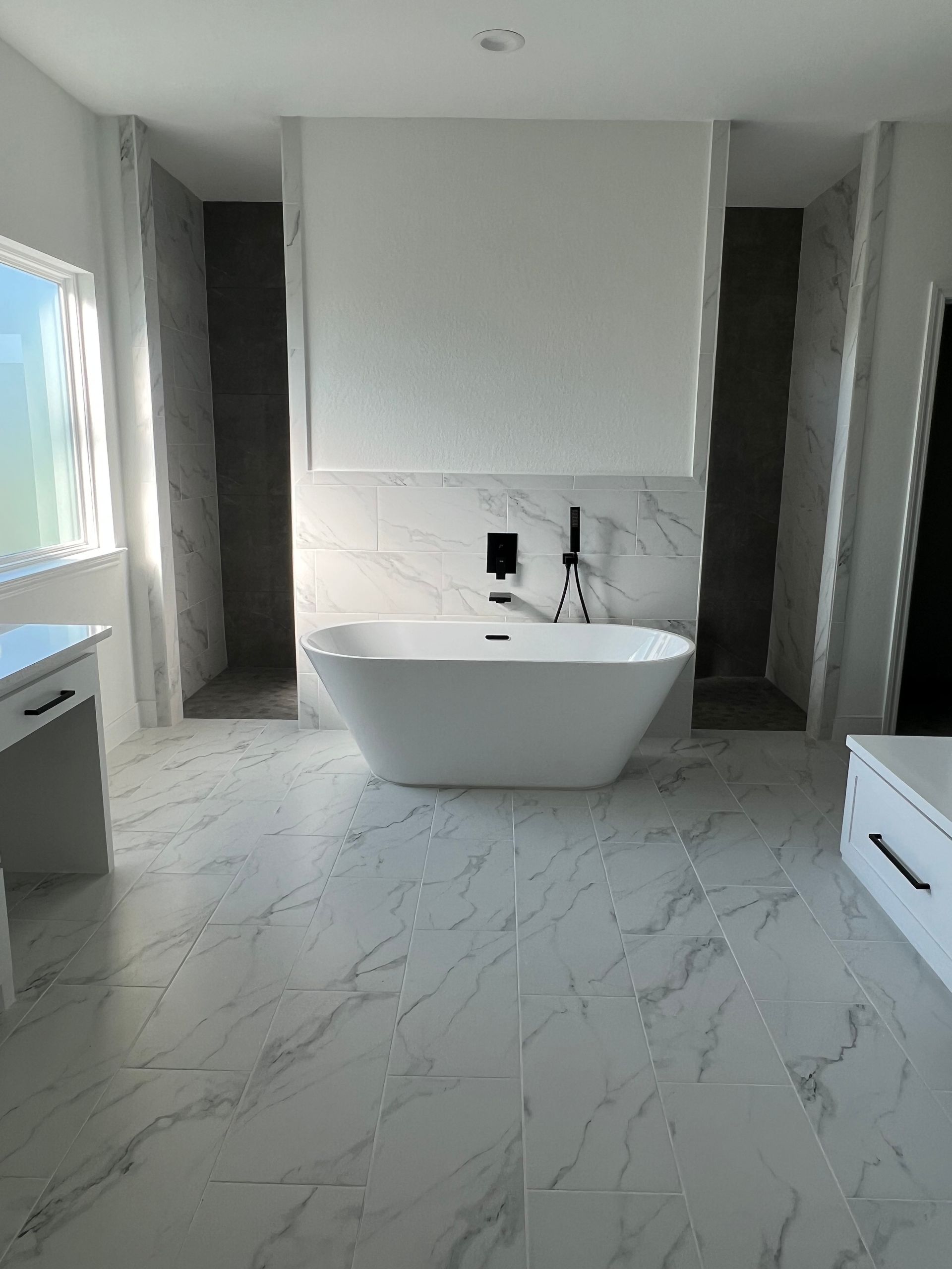 There is a bathtub in the middle of the bathroom.