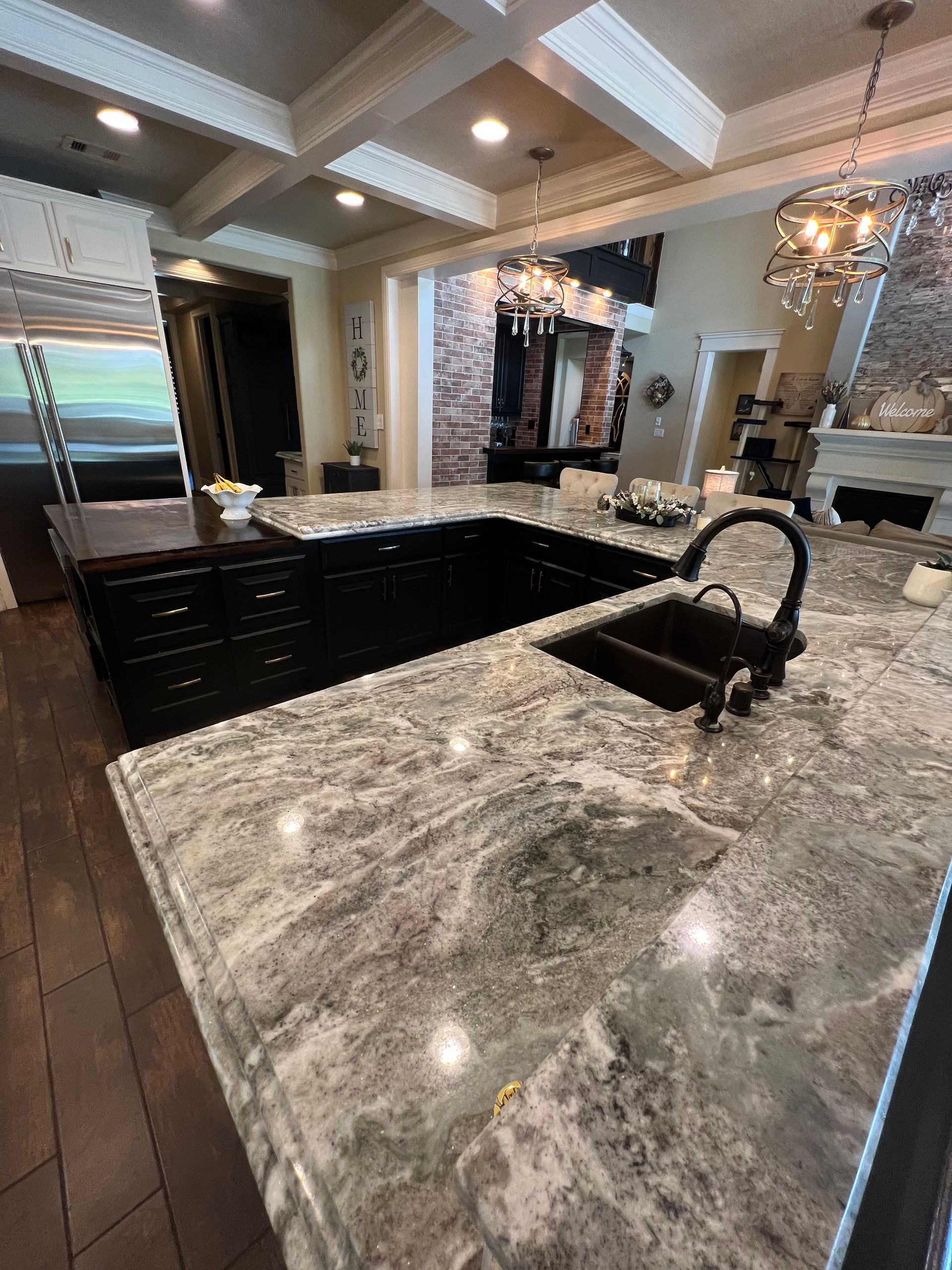 A kitchen with granite counter tops and a sink.