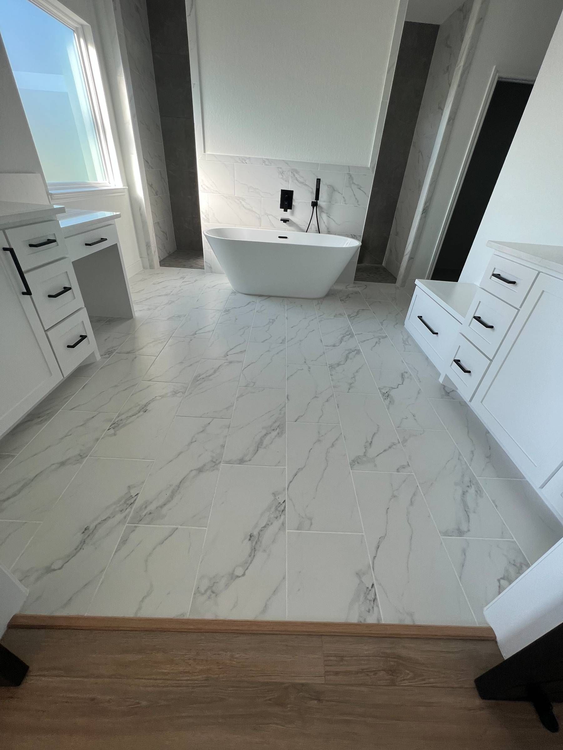 There is a bathtub in the middle of the bathroom.