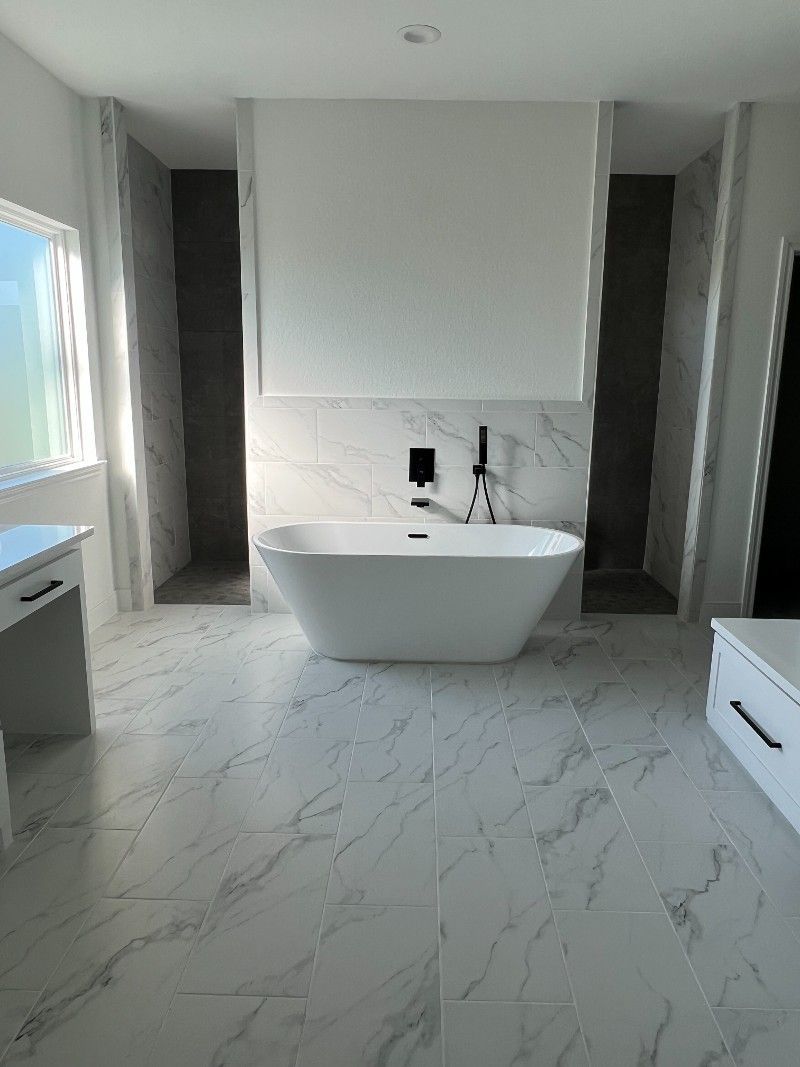 There is a bathtub in the middle of the bathroom.