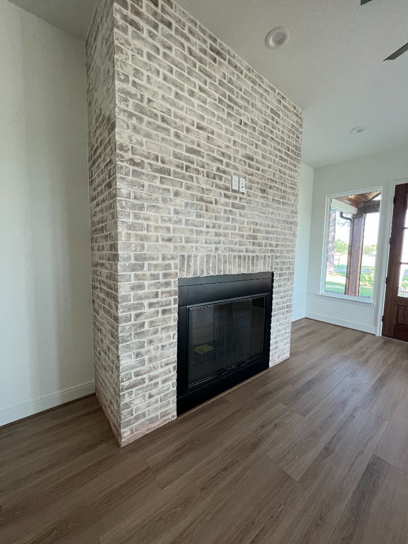 There is a fireplace in the middle of the room.