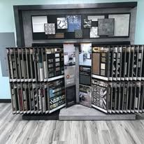 A display case filled with lots of tiles in a store.