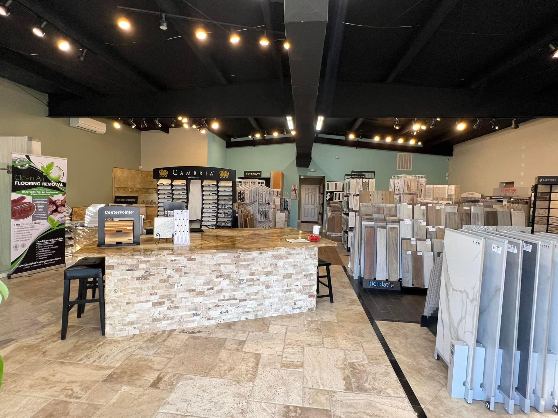 A large room filled with lots of tiles and a counter.