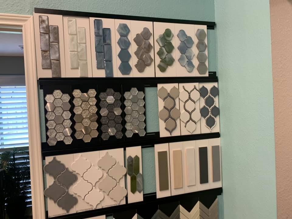 A variety of tiles are displayed on a wall