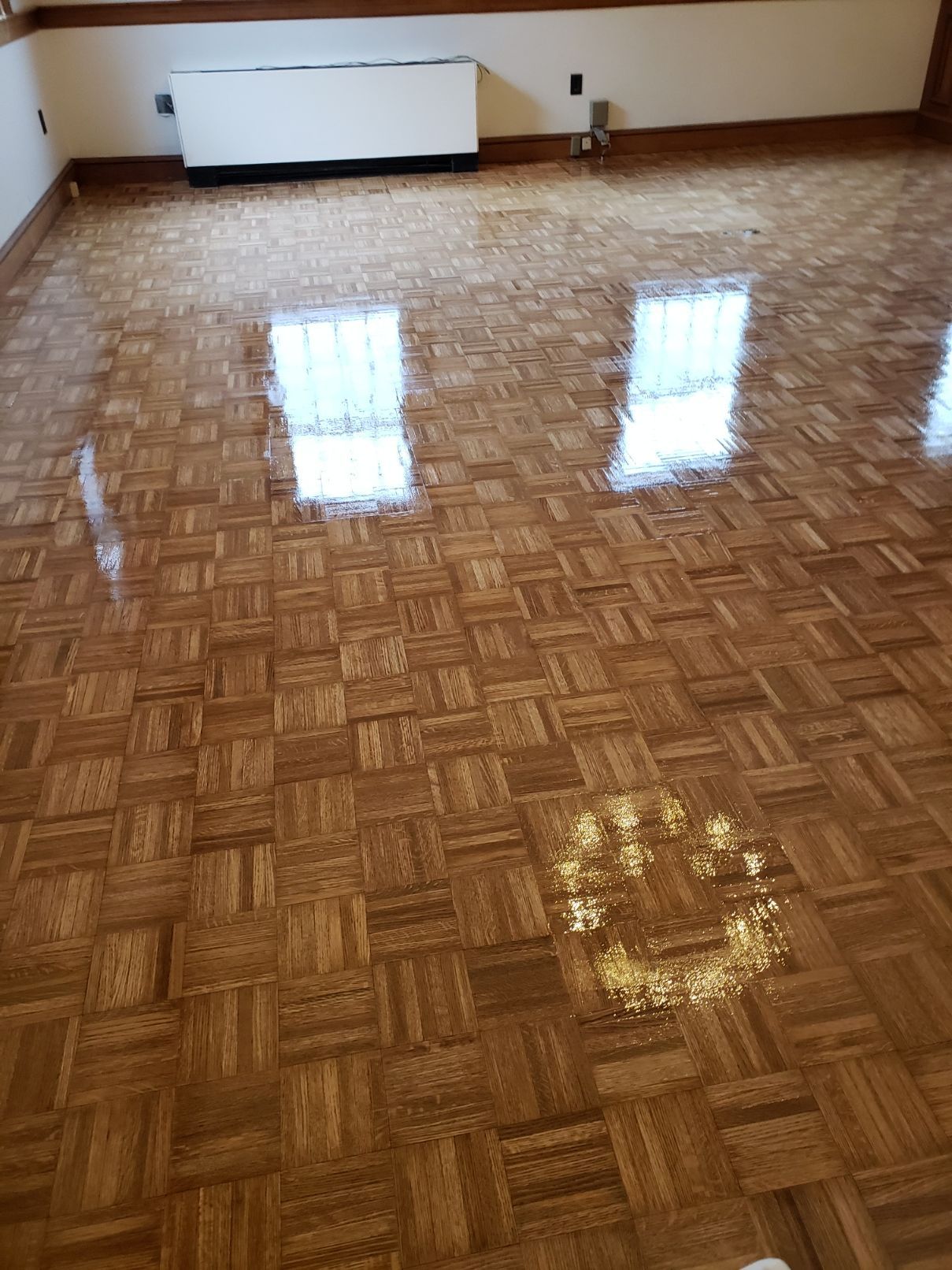 A living room with a wooden floor