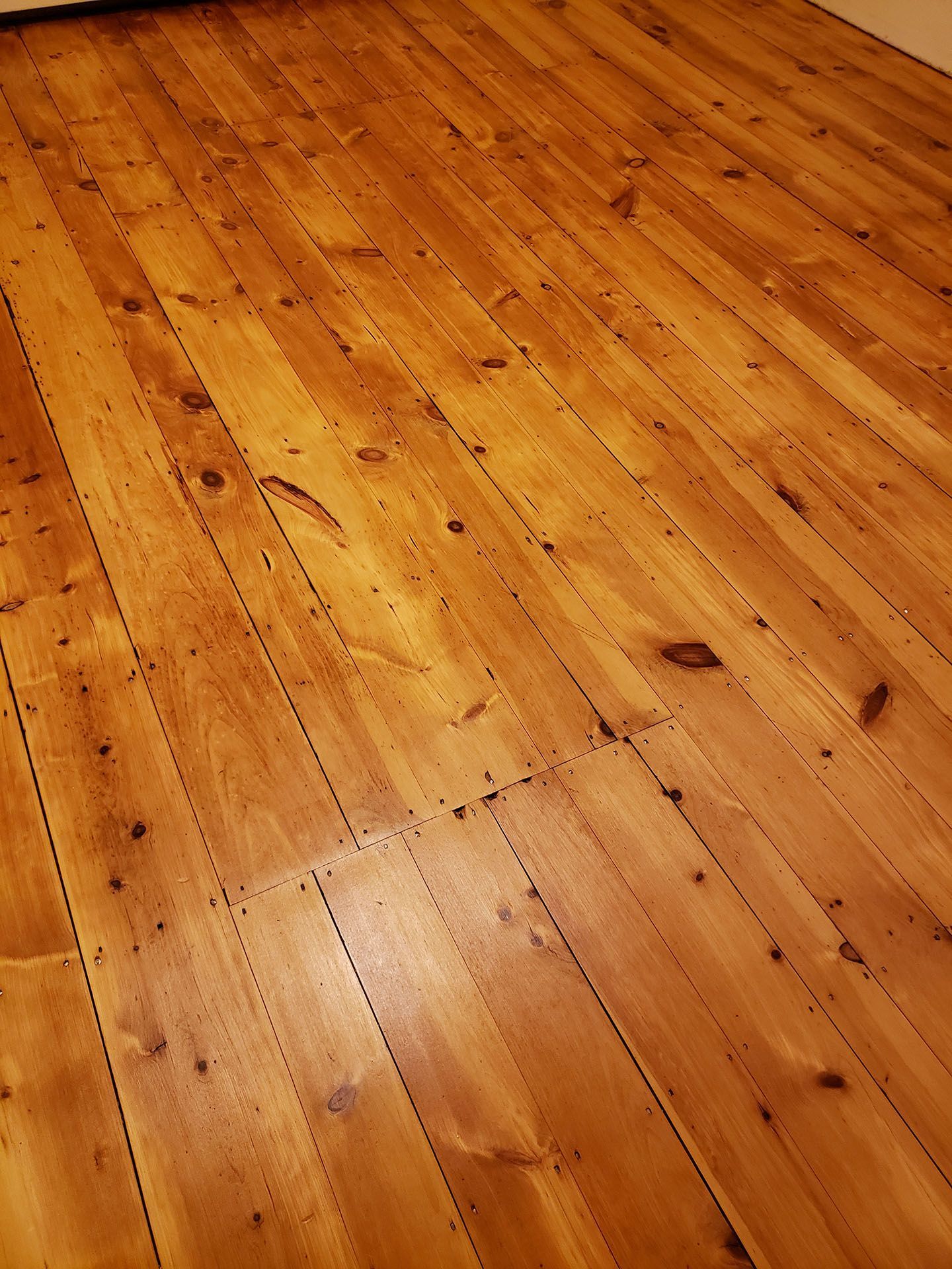 A close up of a wooden floor in a room