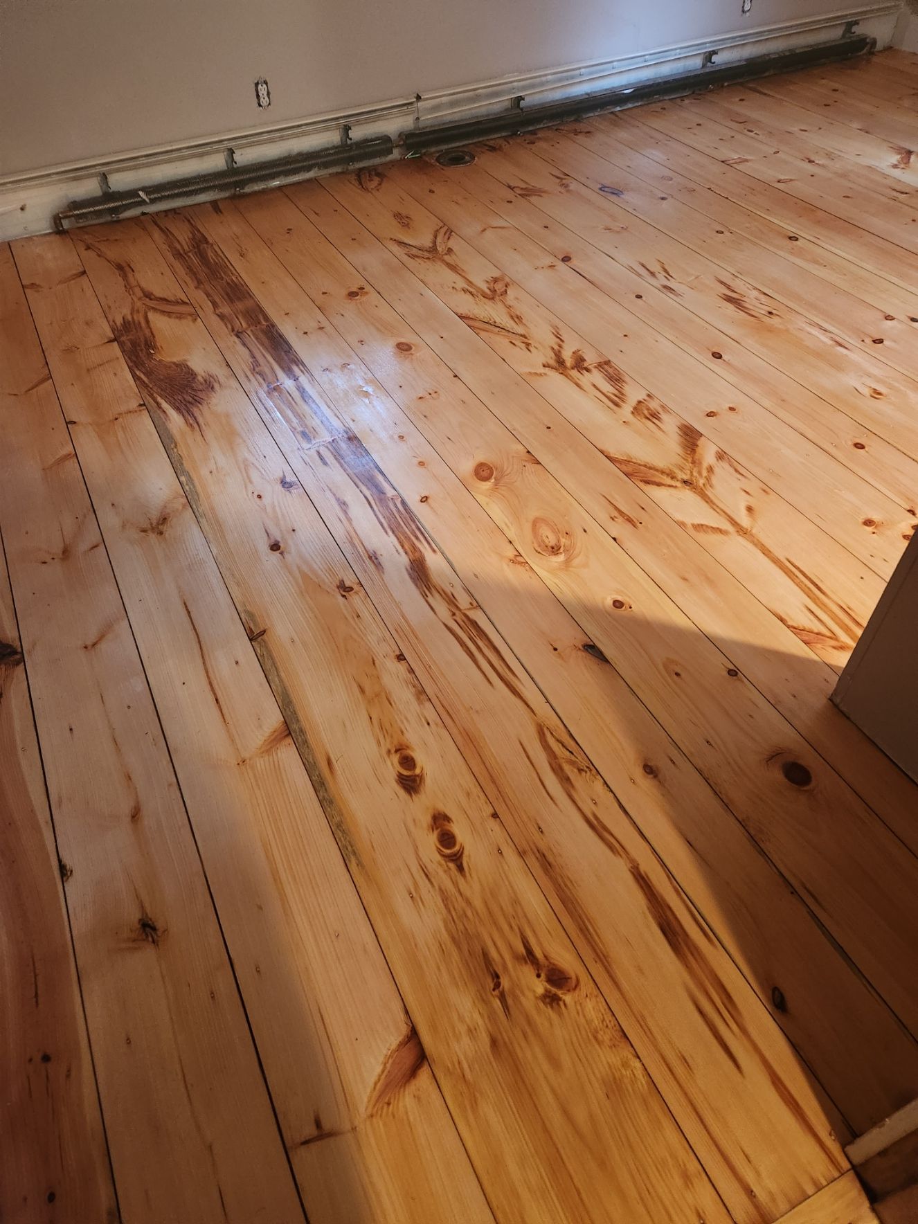 A close up of a wooden floor in a room