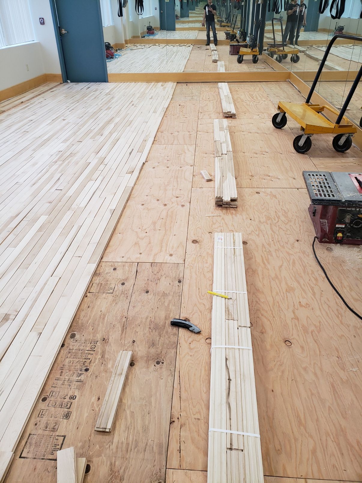 A wooden floor is being installed