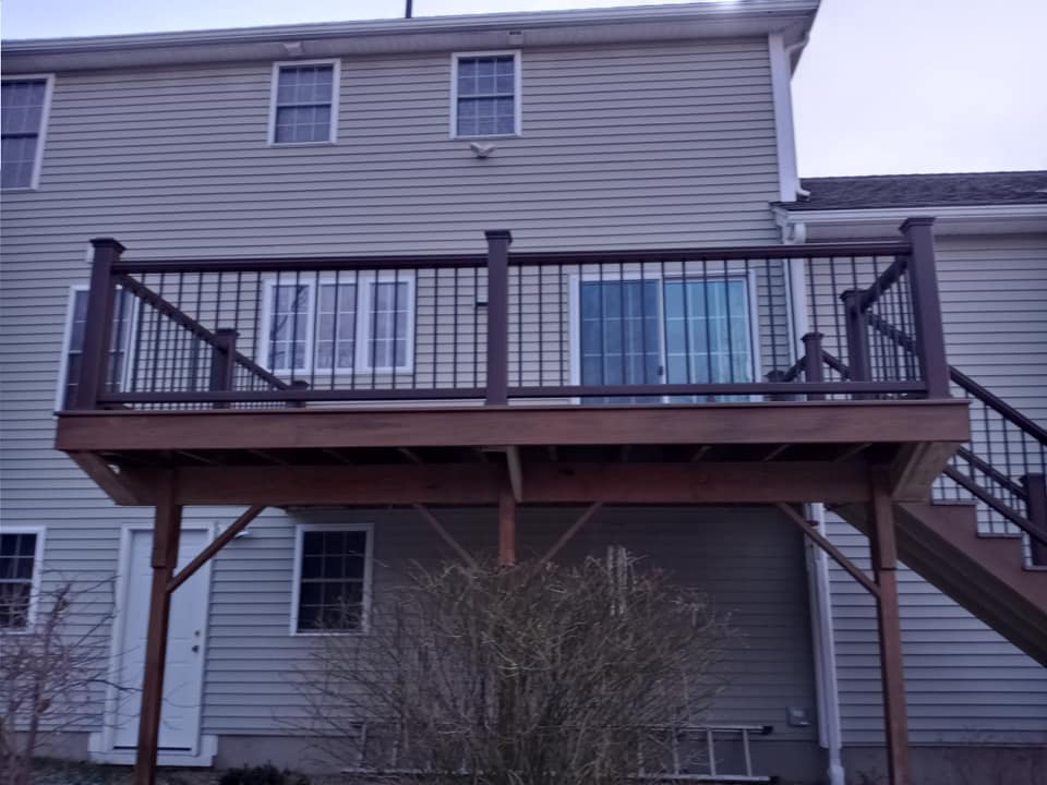 The back of a house with a deck and stairs