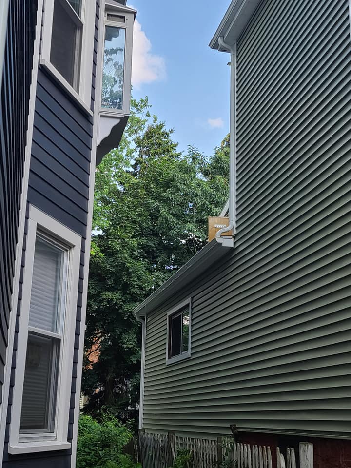 A couple of houses sitting next to each other on a sunny day.