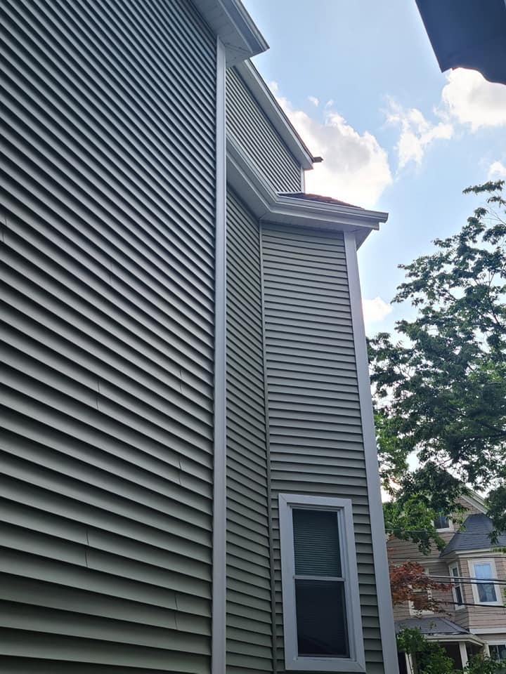 A house with a window on the side of it.