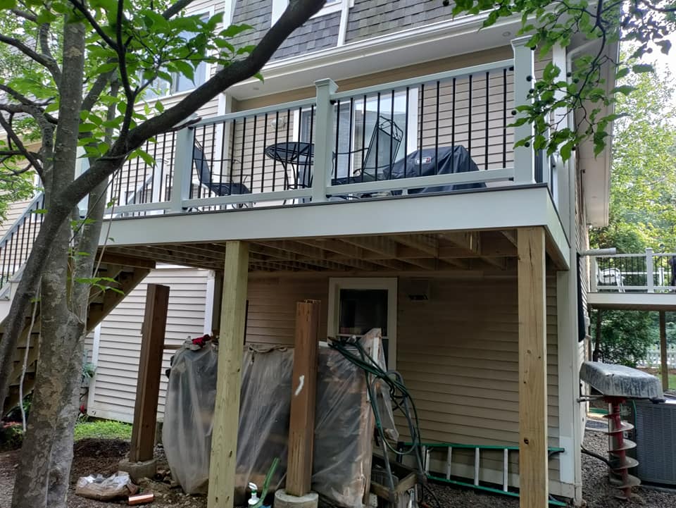 A deck is being built on the side of a house.