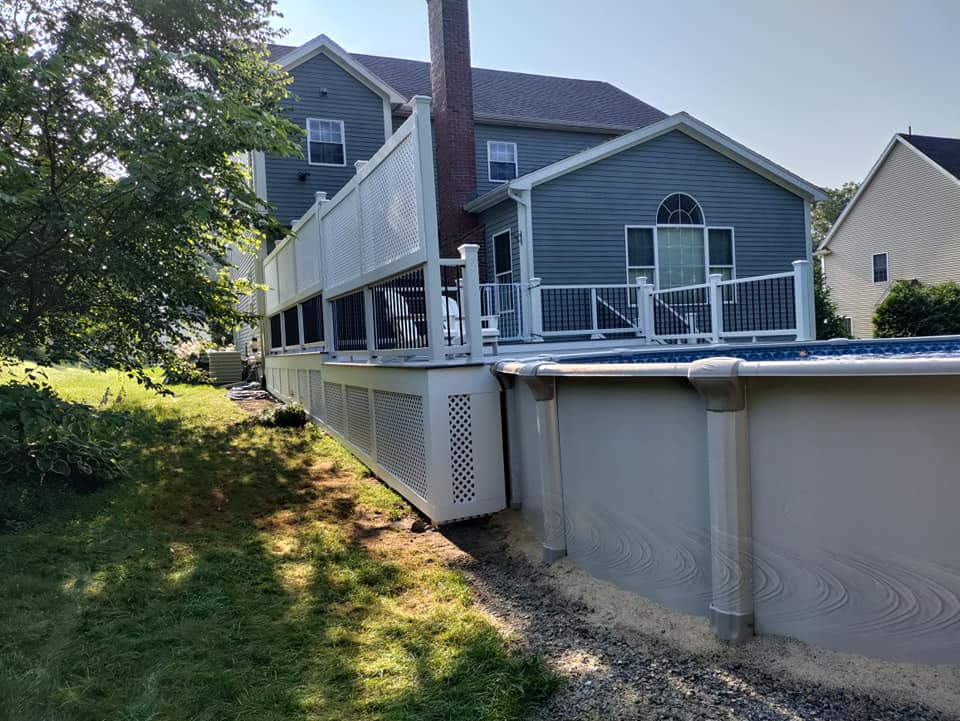 A large house with a swimming pool in front of it
