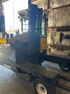 Yellow and black Combi-Lift forklift in a warehouse setting.