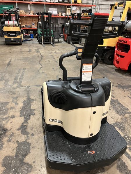 A forklift is parked in a warehouse