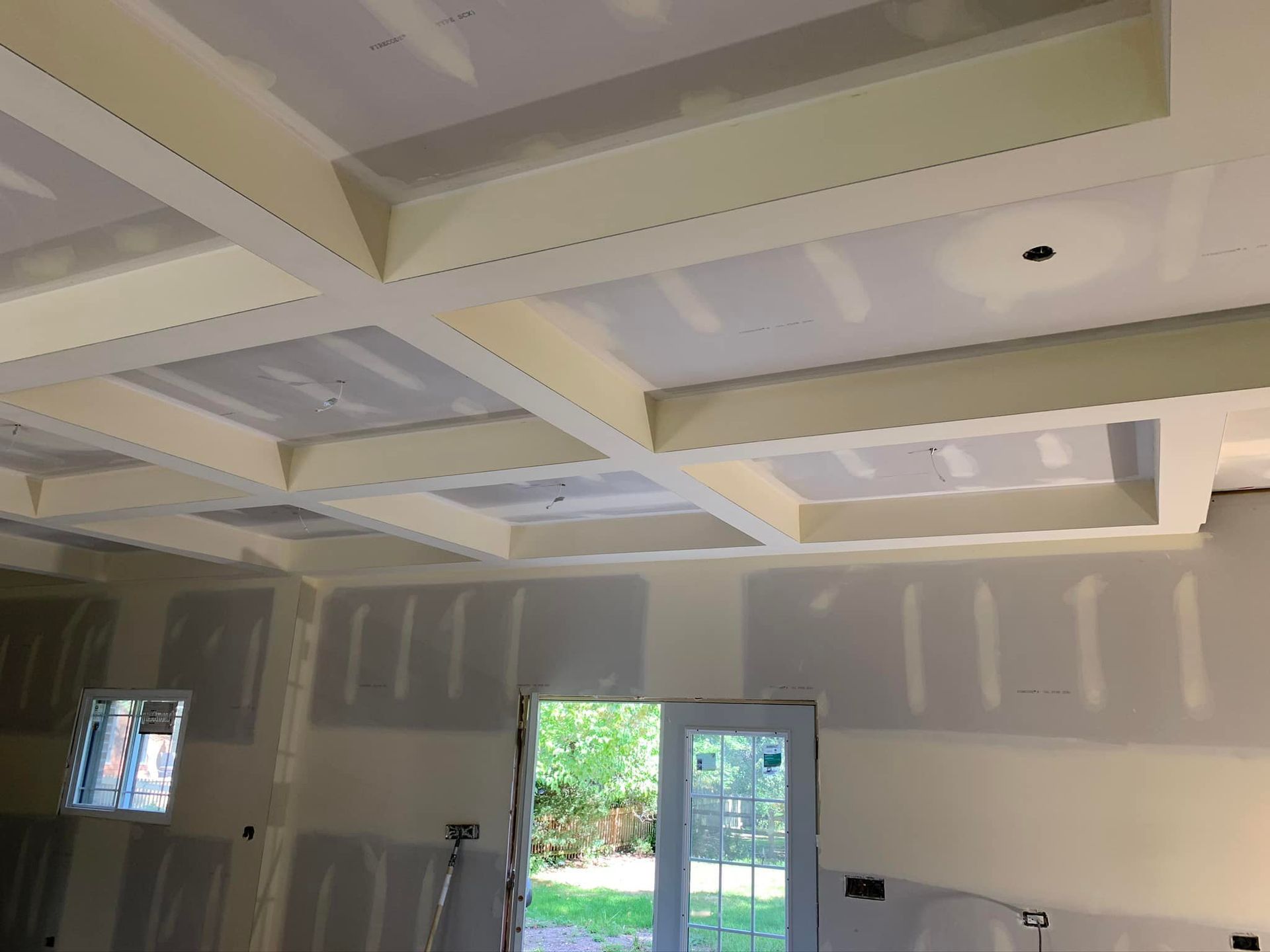 A room with a ceiling that is being built