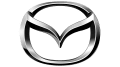 A close up of a mazda logo on a white background.