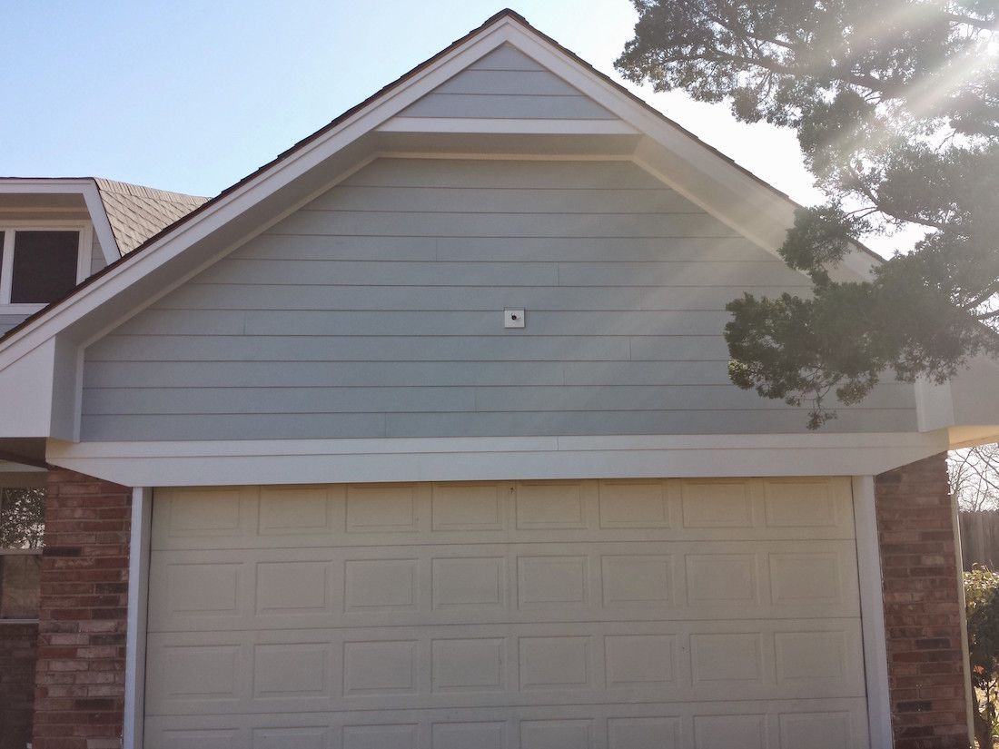 A white garage door with the number 43 on it