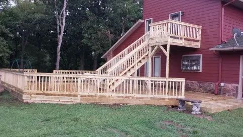 Red house with wooden stairs.