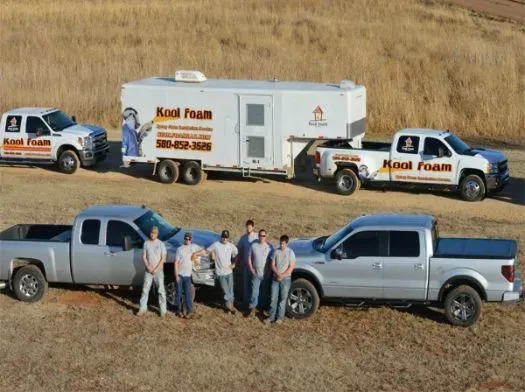 Several trucks with a trailer, labeled 