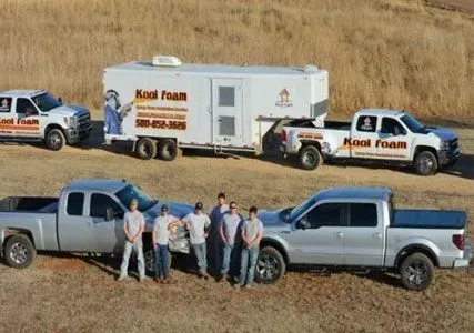 Several trucks and a trailer with the 