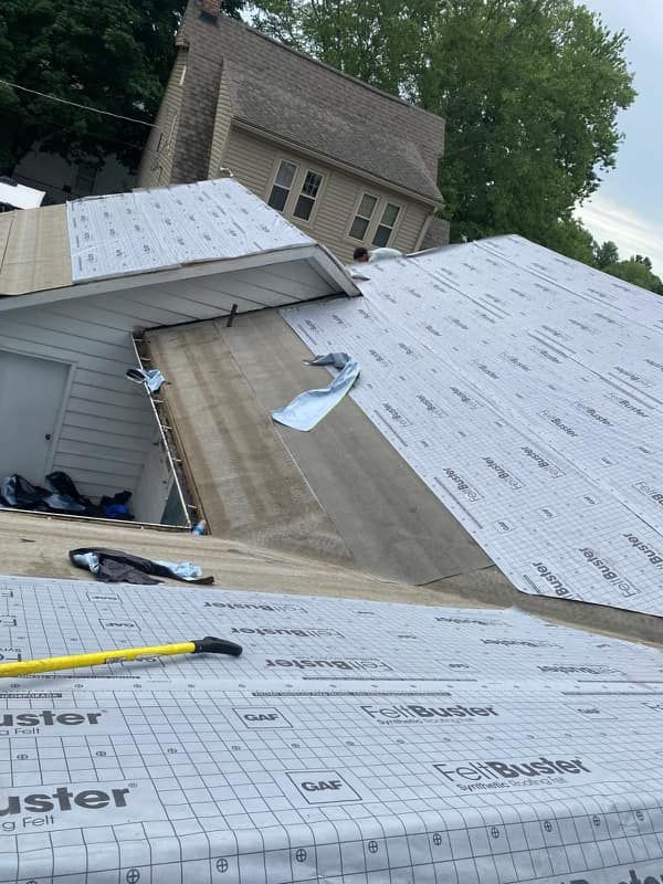 A roof with a lot of roofing material on it.