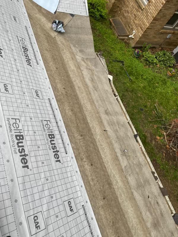 A roof is being installed on a house.