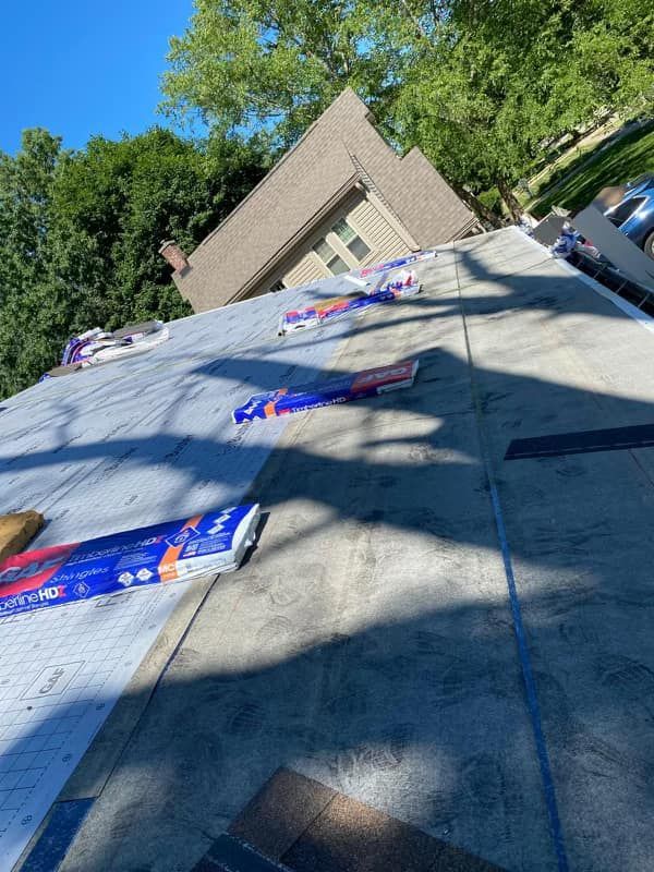 A roof is being installed on a house.