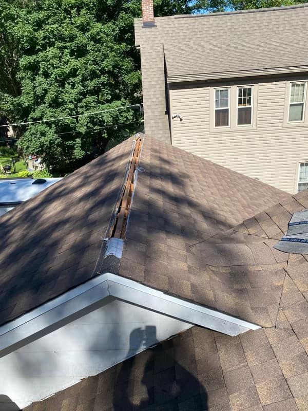 A close up of a roof of a house with a hole in it.