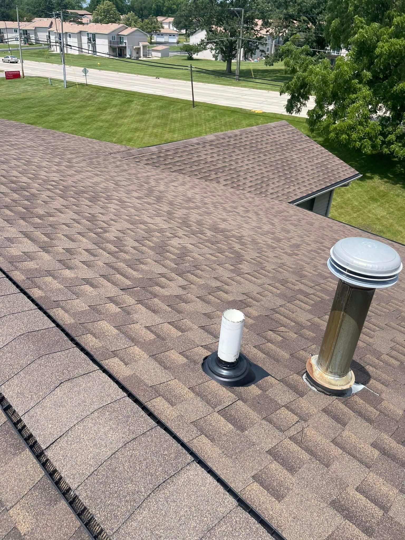 An aerial view of a roof with a chimney on it.