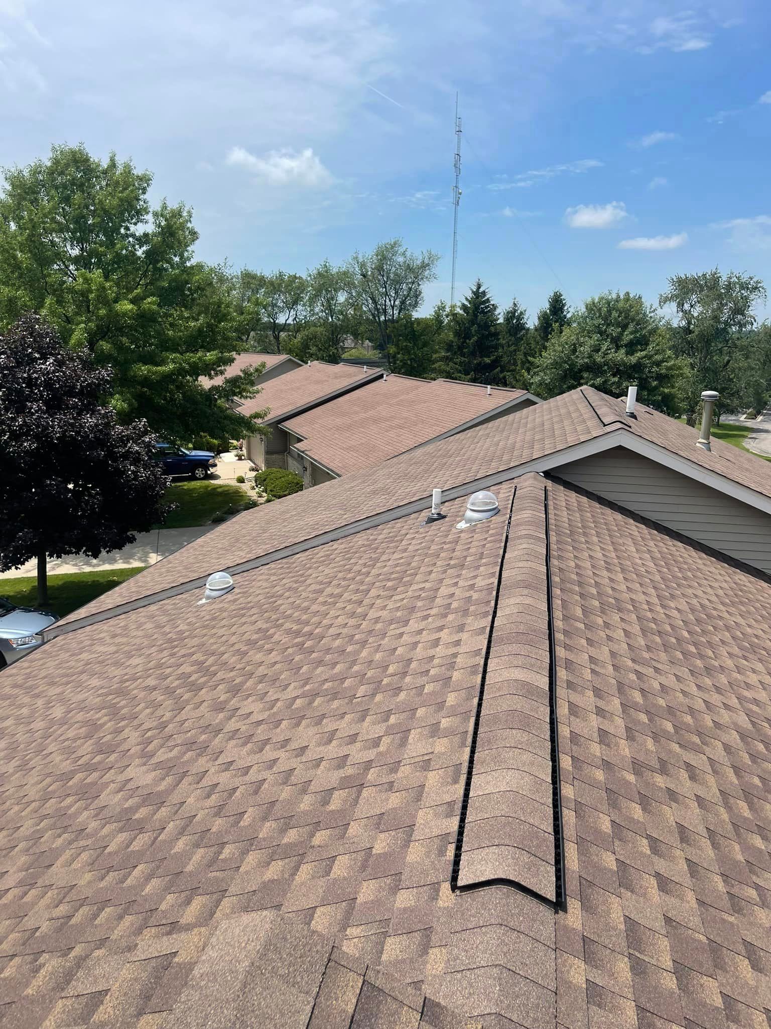 The roof of a house with a lot of shingles on it.